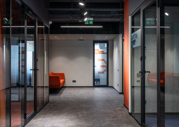 Office corridor with glass partitions