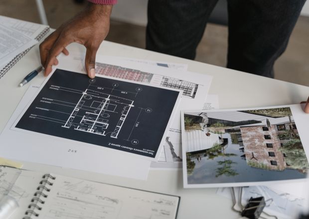 Architect working on 3D layout blueprint